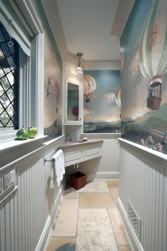 Cette image montre une petite salle de bain traditionnelle avec un lavabo encastré, un placard à porte plane, des portes de placard beiges, un plan de toilette en marbre, WC séparés, un carrelage multicolore, des dalles de pierre, un mur multicolore et un sol en marbre.