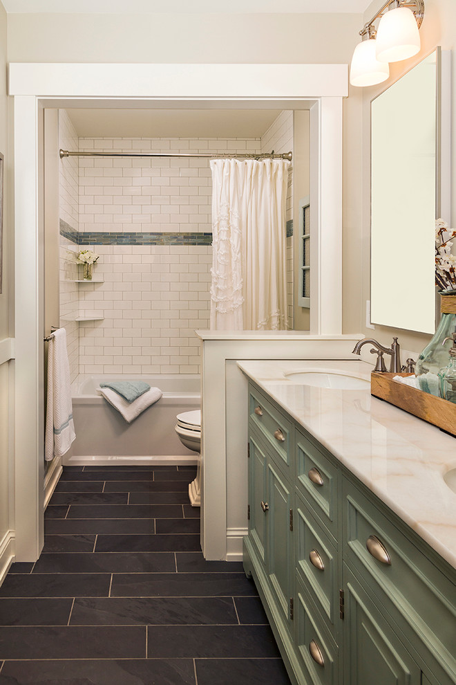 Medium sized traditional bathroom in Minneapolis with green cabinets, an alcove bath, a double shower, a two-piece toilet, white tiles, metro tiles, beige walls, slate flooring, a submerged sink, marble worktops and recessed-panel cabinets.