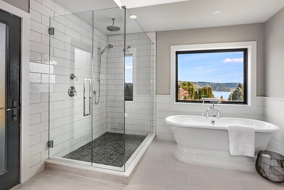 Bathroom - large cottage master white tile and ceramic tile ceramic tile and beige floor bathroom idea in Seattle with furniture-like cabinets, brown cabinets, a one-piece toilet, gray walls, an undermount sink, marble countertops, a hinged shower door and gray countertops