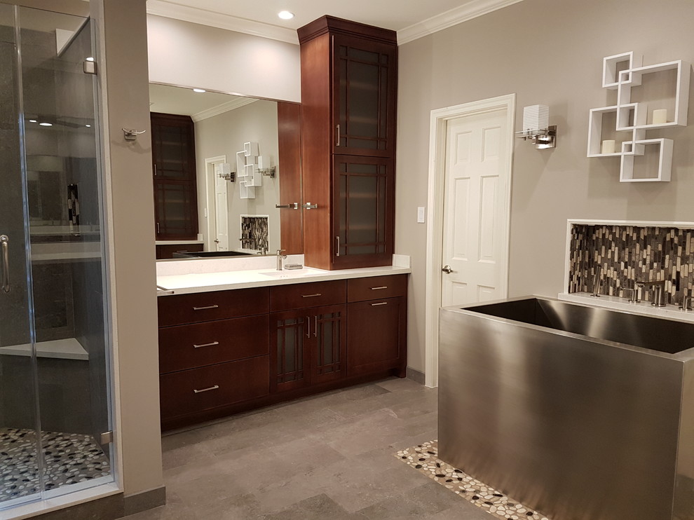 Inspiration for a large world-inspired ensuite bathroom in Houston with shaker cabinets, medium wood cabinets, a japanese bath, a corner shower, a two-piece toilet, beige walls, ceramic flooring, a built-in sink, quartz worktops, grey floors and a hinged door.
