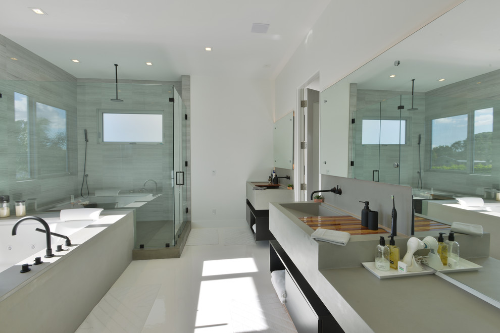 Example of a large minimalist master alcove shower design in Los Angeles with open cabinets, black cabinets, a hot tub, gray walls, a trough sink and solid surface countertops