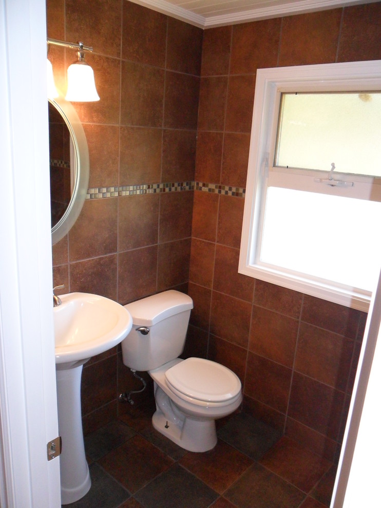 Example of a small classic brown tile and porcelain tile porcelain tile alcove bathtub design in Seattle with a pedestal sink, a two-piece toilet and brown walls