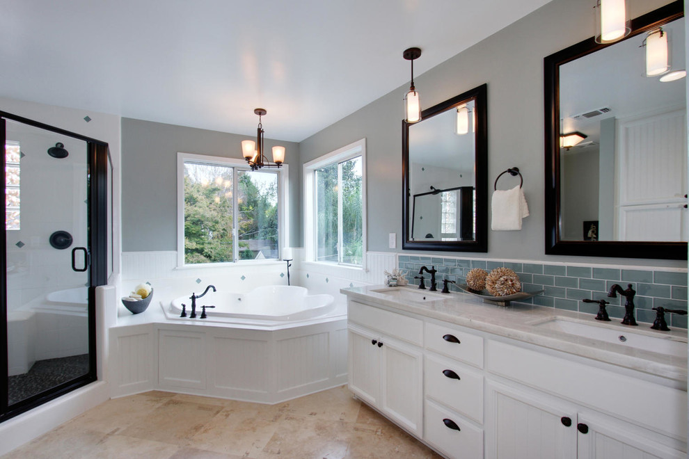 Design ideas for a large classic bathroom in Sacramento with recessed-panel cabinets, white cabinets, an alcove bath, grey walls, limestone flooring, a submerged sink, marble worktops, beige floors, a hinged door and white worktops.