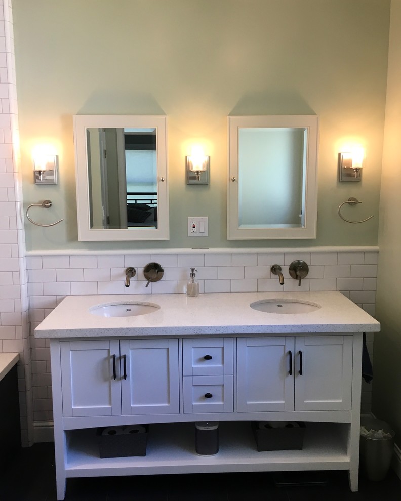 Inspiration for a timeless white tile and ceramic tile bathroom remodel in Sacramento with shaker cabinets, white cabinets, an undermount tub and quartzite countertops