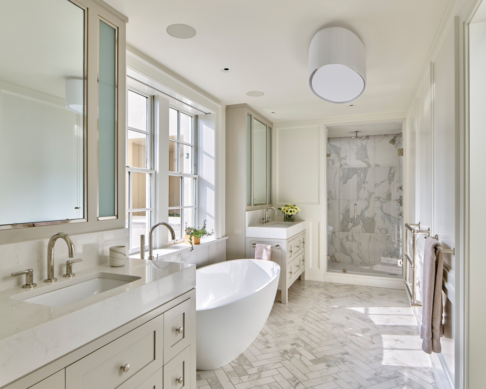 Inspiration for a traditional ensuite bathroom in Philadelphia with shaker cabinets, grey cabinets, a freestanding bath, an alcove shower, white tiles, white walls, a submerged sink, white floors, a hinged door, white worktops, double sinks, a freestanding vanity unit and panelled walls.