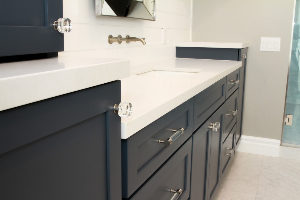 Bathroom - large coastal master white tile yellow floor, single-sink and shiplap wall bathroom idea in Los Angeles with blue cabinets, a one-piece toilet, beige walls, a drop-in sink, quartz countertops, white countertops and a built-in vanity