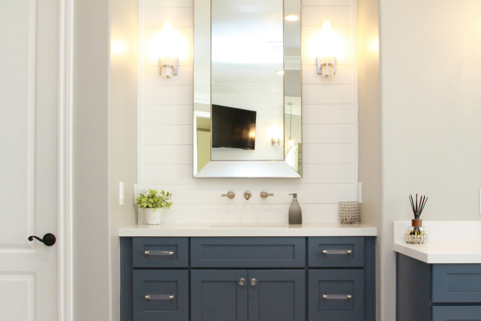 Inspiration for a large coastal master white tile yellow floor, single-sink and shiplap wall bathroom remodel in Los Angeles with blue cabinets, a one-piece toilet, beige walls, a drop-in sink, quartz countertops, white countertops and a built-in vanity