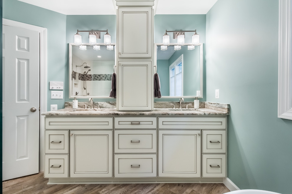 Design ideas for a large traditional ensuite bathroom in DC Metro with beaded cabinets, white cabinets, a freestanding bath, a corner shower, a two-piece toilet, brown tiles, porcelain tiles, blue walls, porcelain flooring, a submerged sink, granite worktops, multi-coloured floors and an open shower.