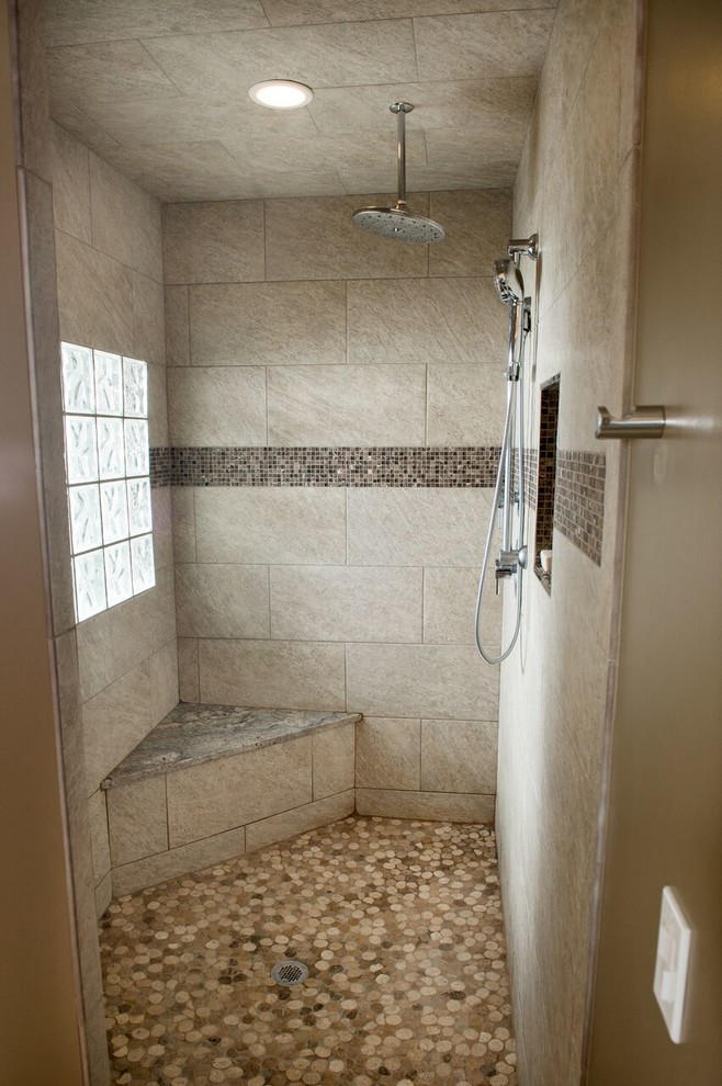 Huge transitional master beige tile and stone tile pebble tile floor and multicolored floor bathroom photo in Other with shaker cabinets, medium tone wood cabinets, beige walls, a vessel sink, granite countertops and a two-piece toilet