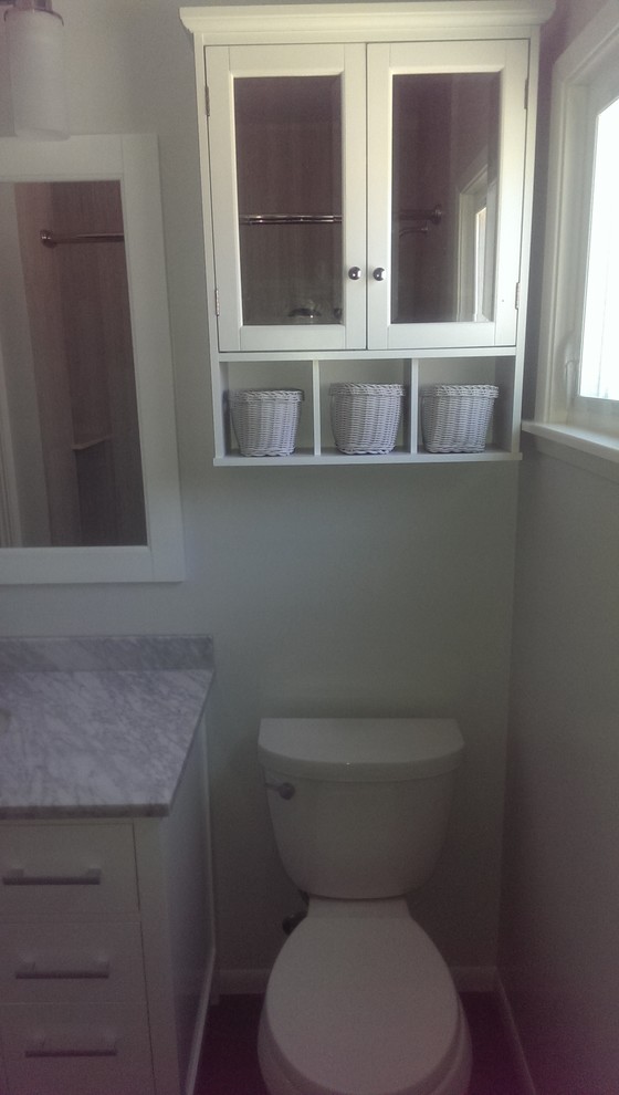 Photo of a medium sized classic shower room bathroom in Los Angeles with shaker cabinets, white cabinets, marble worktops, a corner bath, a shower/bath combination, a two-piece toilet, grey tiles, porcelain tiles, grey walls, porcelain flooring and a submerged sink.