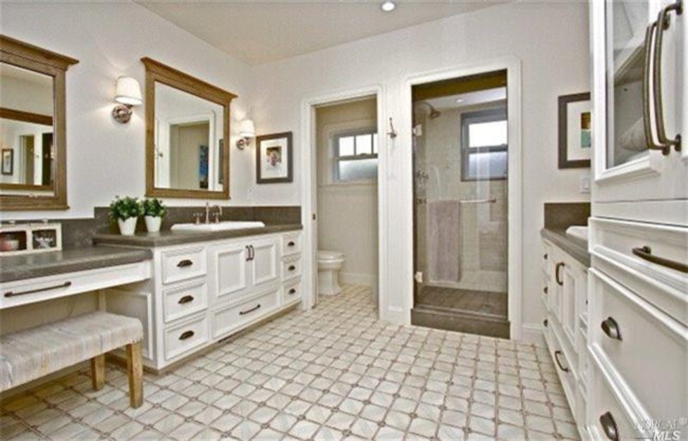 Mid-sized transitional master blue tile and porcelain tile ceramic tile bathroom photo in San Francisco with raised-panel cabinets, white cabinets, a one-piece toilet, blue walls, a drop-in sink and tile countertops