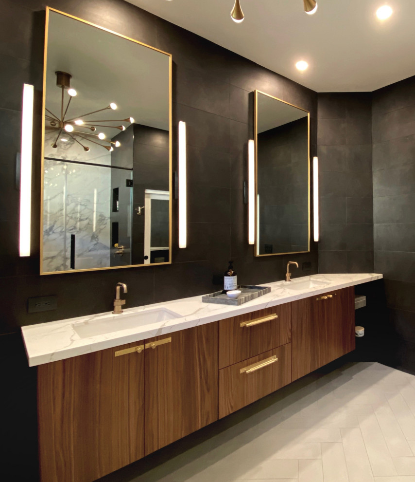 Freestanding bathtub - large contemporary master black tile and porcelain tile porcelain tile and gray floor freestanding bathtub idea in Las Vegas with flat-panel cabinets, medium tone wood cabinets, a one-piece toilet, black walls, an undermount sink, quartz countertops and white countertops