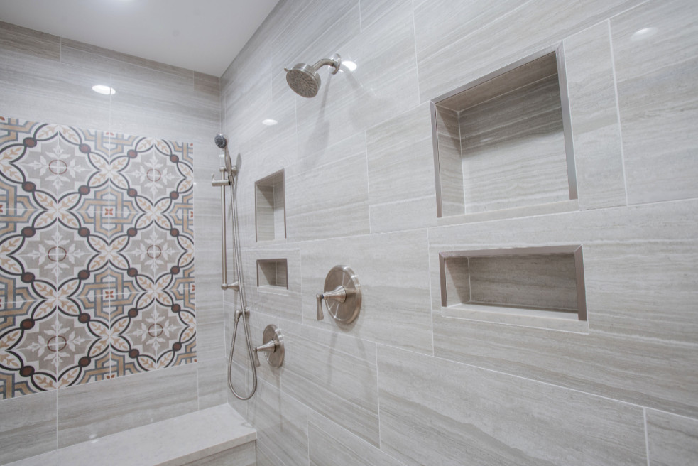 Inspiration for a mid-sized contemporary 3/4 multicolored tile and cement tile pebble tile floor and brown floor walk-in shower remodel in San Francisco with flat-panel cabinets, gray cabinets, gray walls, an undermount sink, marble countertops, a hinged shower door and gray countertops