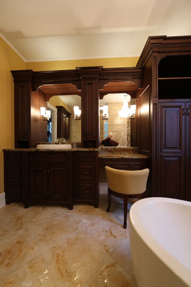 Elegant master beige tile and black tile beige floor bathroom photo in Orlando with beaded inset cabinets, dark wood cabinets, beige walls, a drop-in sink, granite countertops and a hinged shower door