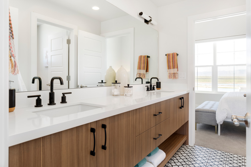 Beach style multicolored floor and double-sink bathroom photo in Salt Lake City with flat-panel cabinets, brown cabinets, white walls, an undermount sink, white countertops and a built-in vanity