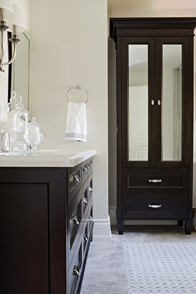Design ideas for a large traditional ensuite bathroom in Toronto with a submerged sink, beaded cabinets, dark wood cabinets, engineered stone worktops, beige tiles, mosaic tiles, beige walls and porcelain flooring.
