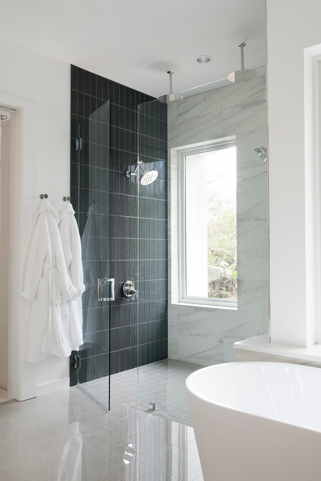 Design ideas for a contemporary bathroom in Austin with a freestanding bath, black tiles, white walls and white floors.