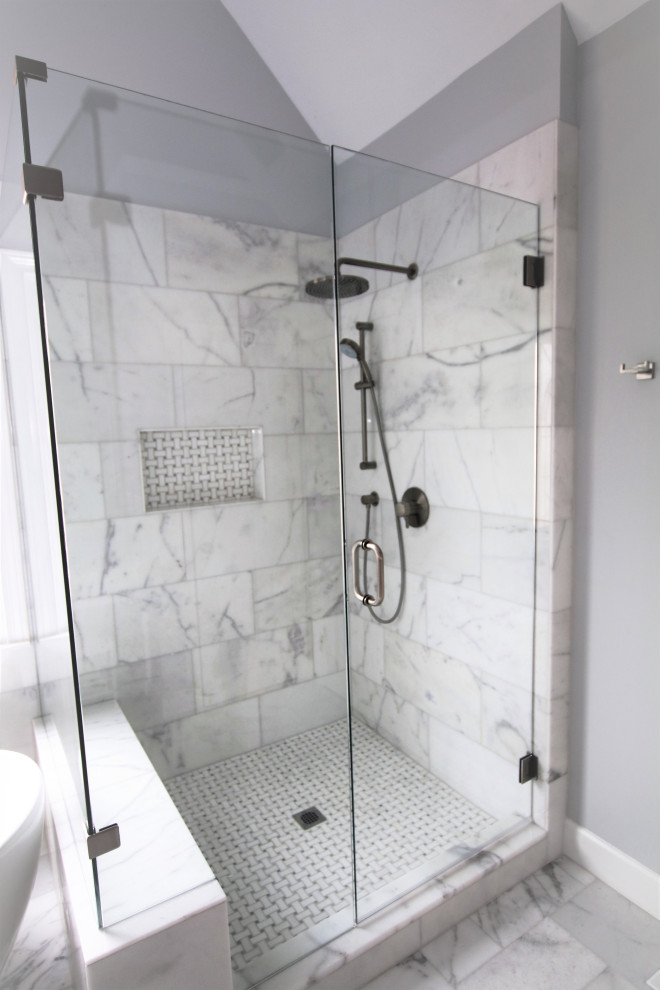 Photo of a large modern ensuite bathroom in Atlanta with shaker cabinets, white cabinets, a freestanding bath, a corner shower, a submerged sink, marble worktops and a hinged door.