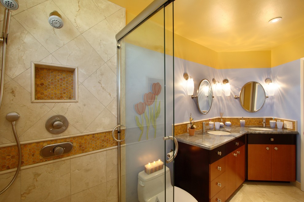 Design ideas for a contemporary bathroom in San Diego with mosaic tiles, a built-in sink, flat-panel cabinets, dark wood cabinets, granite worktops, an alcove shower, a one-piece toilet, beige tiles, multi-coloured walls and marble flooring.