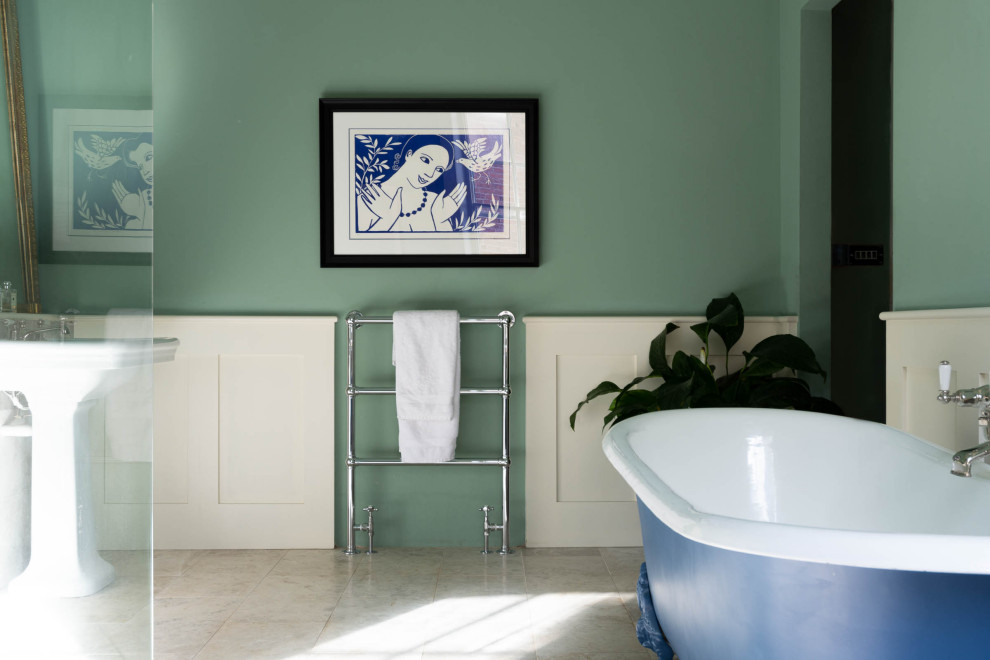 Classic bathroom in Other with a freestanding bath, green walls, marble flooring and grey floors.