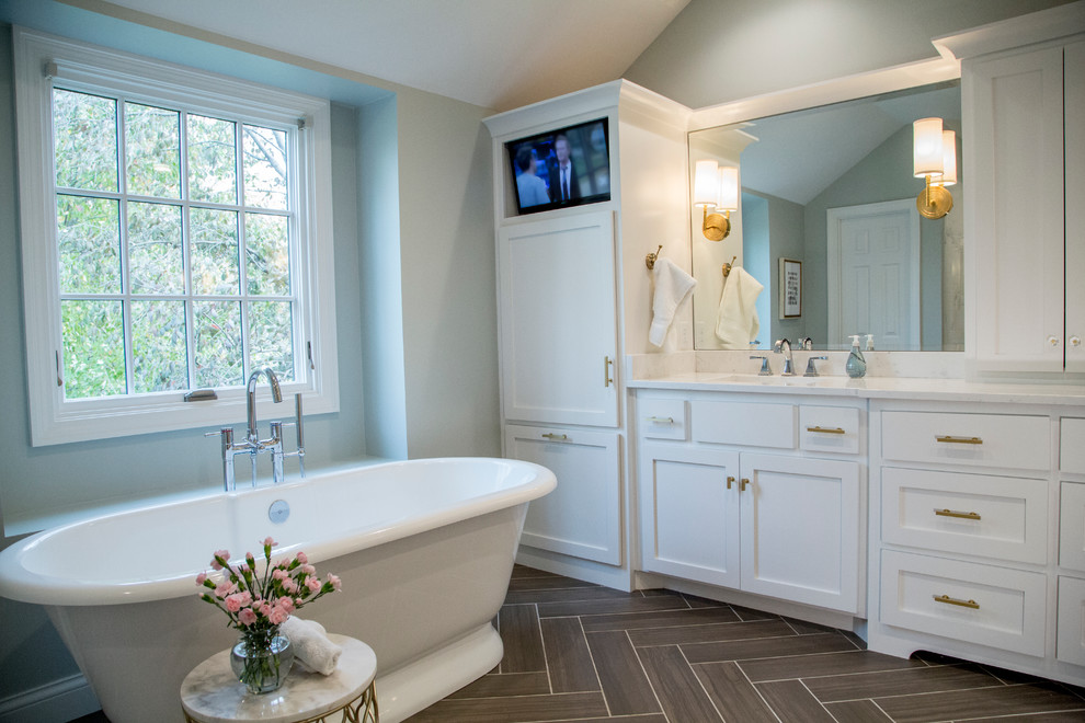Medium sized classic ensuite bathroom in Kansas City with shaker cabinets, white cabinets, a freestanding bath, an alcove shower, a two-piece toilet, white tiles, ceramic tiles, green walls, porcelain flooring, a submerged sink and engineered stone worktops.