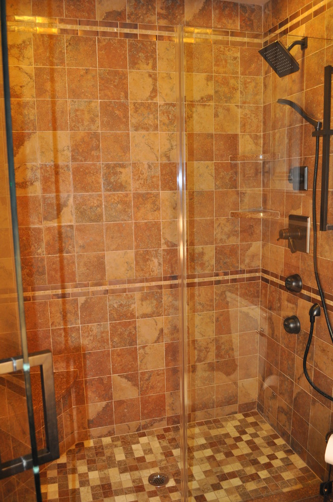 Minimalist brown tile ceramic tile alcove shower photo in New York with an undermount sink and quartzite countertops