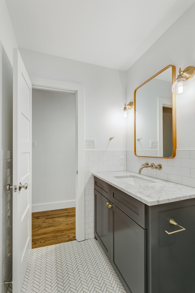 Mid-sized transitional kids' white tile and subway tile mosaic tile floor and white floor bathroom photo in Dallas with shaker cabinets, black cabinets, white walls, an undermount sink and marble countertops