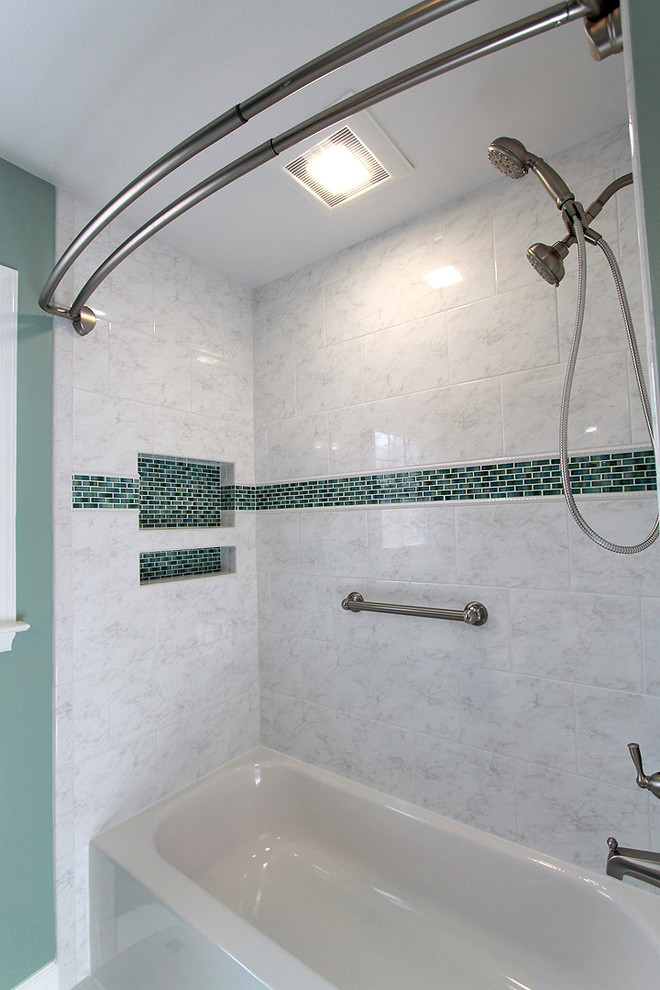 This is an example of a classic bathroom in DC Metro with an alcove bath, a two-piece toilet, yellow tiles, ceramic tiles, green walls and ceramic flooring.