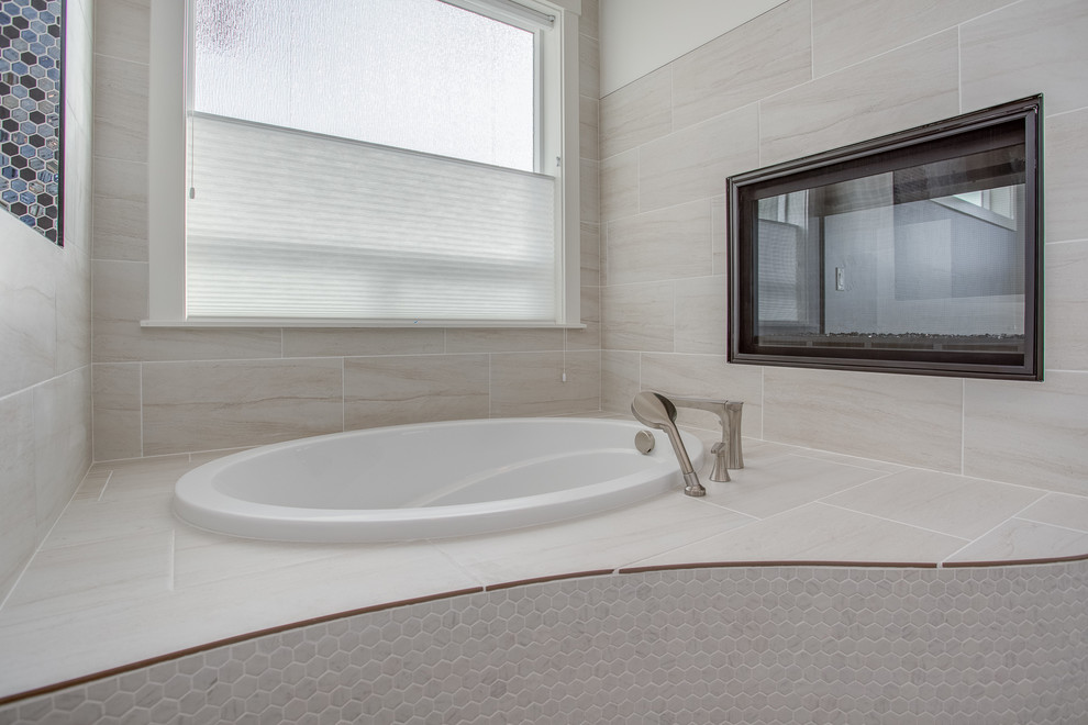 Inspiration for a mid-sized transitional master beige tile and porcelain tile porcelain tile and beige floor bathroom remodel in Boise with recessed-panel cabinets, dark wood cabinets, a two-piece toilet, beige walls, an undermount sink, granite countertops and gray countertops