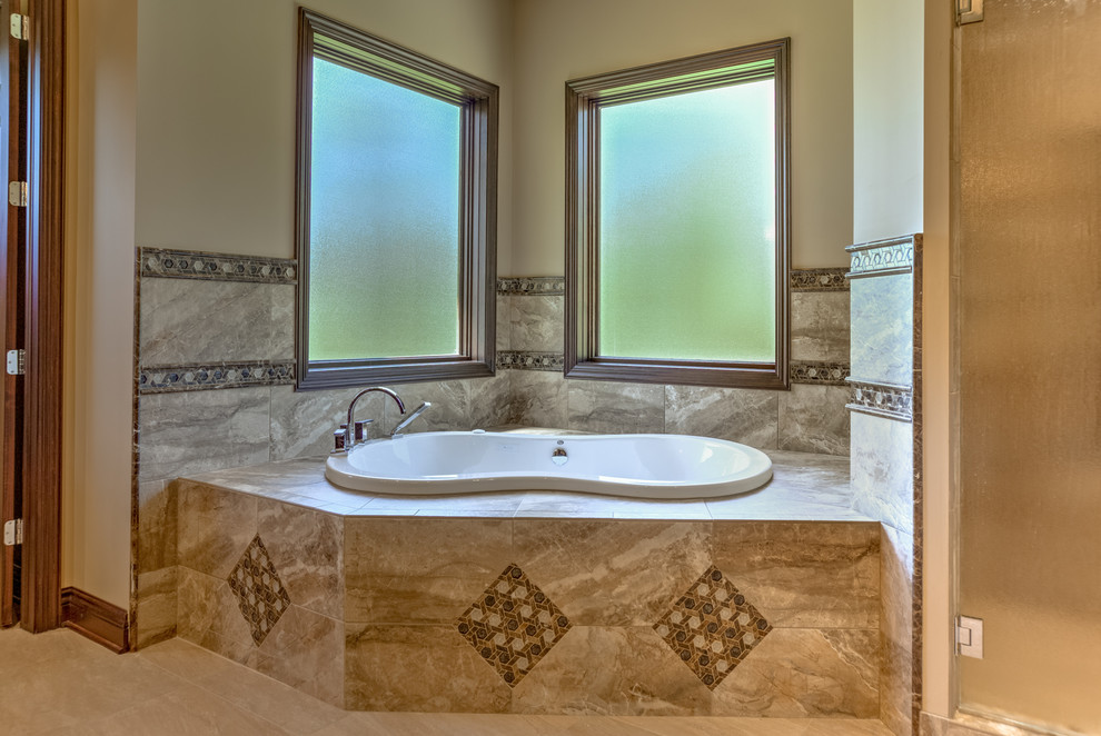 Bathroom - large contemporary brown tile and porcelain tile porcelain tile bathroom idea in Omaha with an undermount sink, recessed-panel cabinets, medium tone wood cabinets, quartz countertops, a one-piece toilet and beige walls