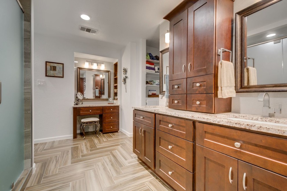 Inspiration for a large contemporary ensuite bathroom in Dallas with raised-panel cabinets, medium wood cabinets, an alcove shower, beige tiles, white walls, ceramic flooring, a built-in sink and granite worktops.