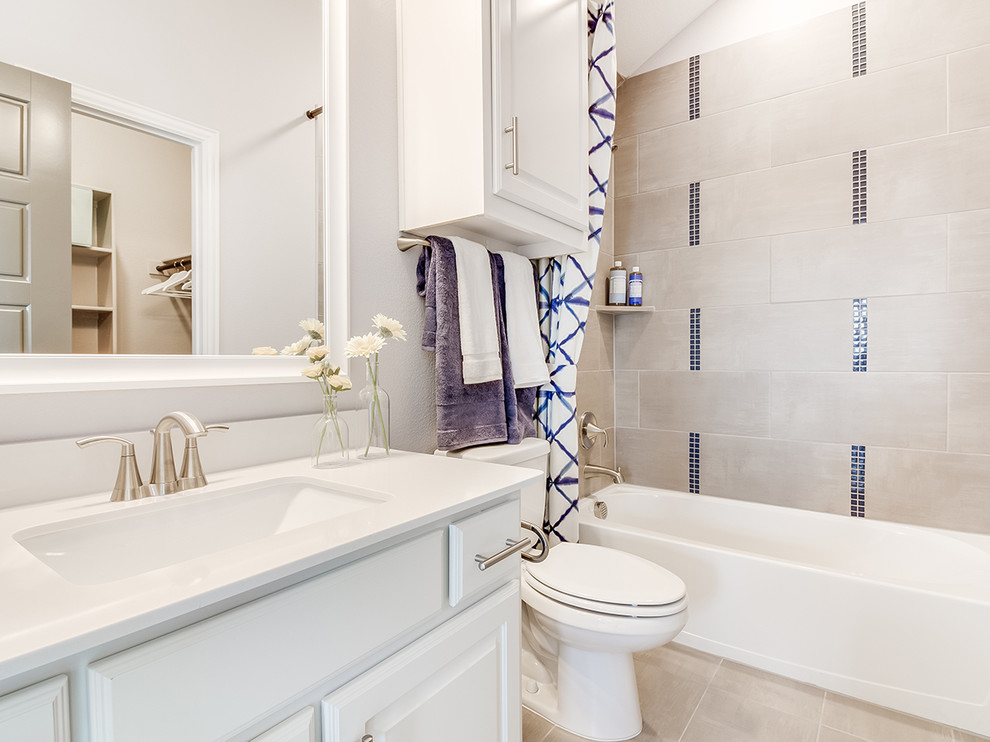 Small minimalist kids' beige tile and mosaic tile ceramic tile and beige floor bathroom photo in Dallas with raised-panel cabinets, white cabinets, a one-piece toilet, gray walls, an undermount sink and white countertops