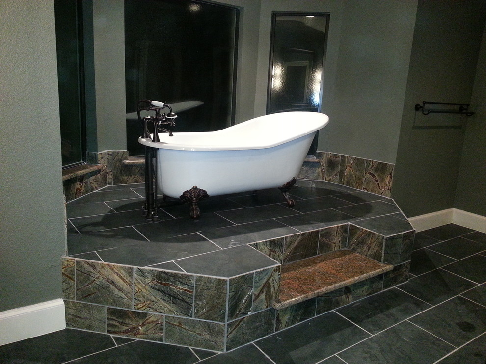 Traditional ensuite bathroom in Dallas with a claw-foot bath, multi-coloured tiles, stone tiles, green walls and slate flooring.