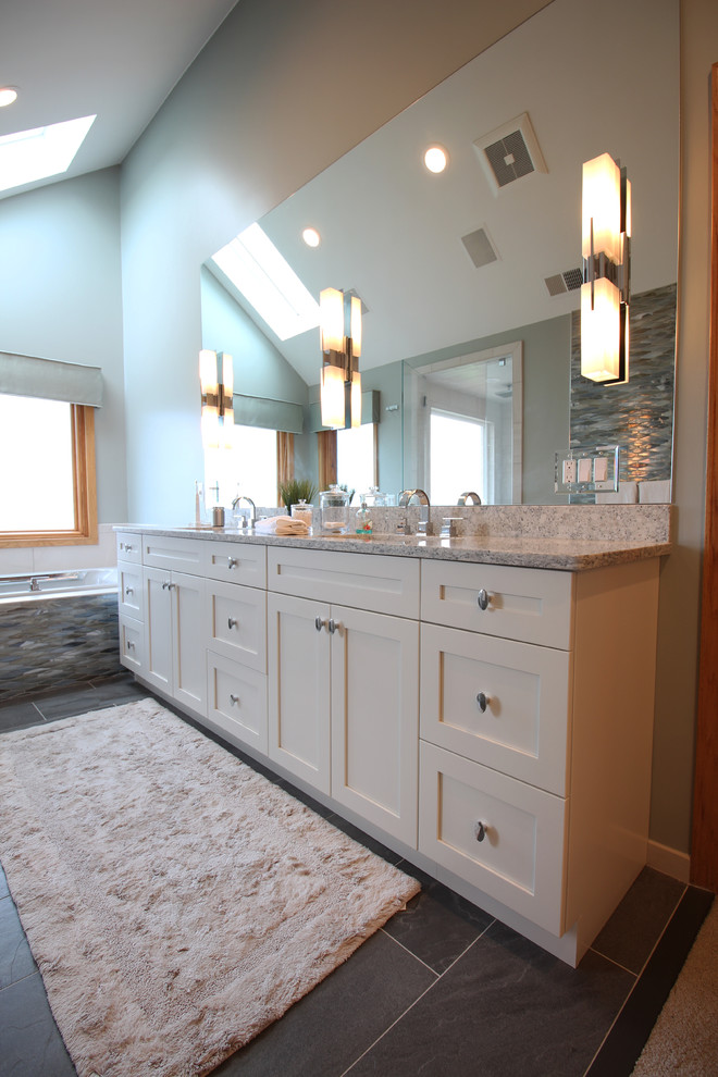 Inspiration for a large contemporary master multicolored tile and mosaic tile ceramic tile and gray floor bathroom remodel in Detroit with shaker cabinets, white cabinets, a two-piece toilet, gray walls, an undermount sink, quartz countertops and a hinged shower door
