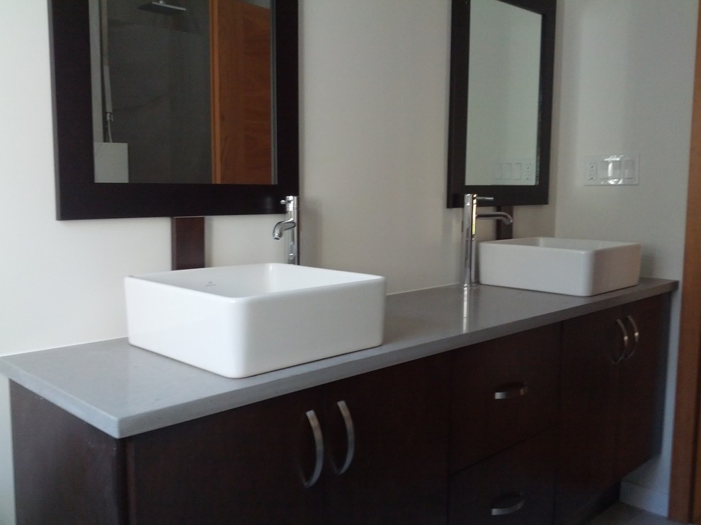 Small trendy master bathroom photo in Vancouver with a vessel sink, flat-panel cabinets, dark wood cabinets, quartz countertops and white walls