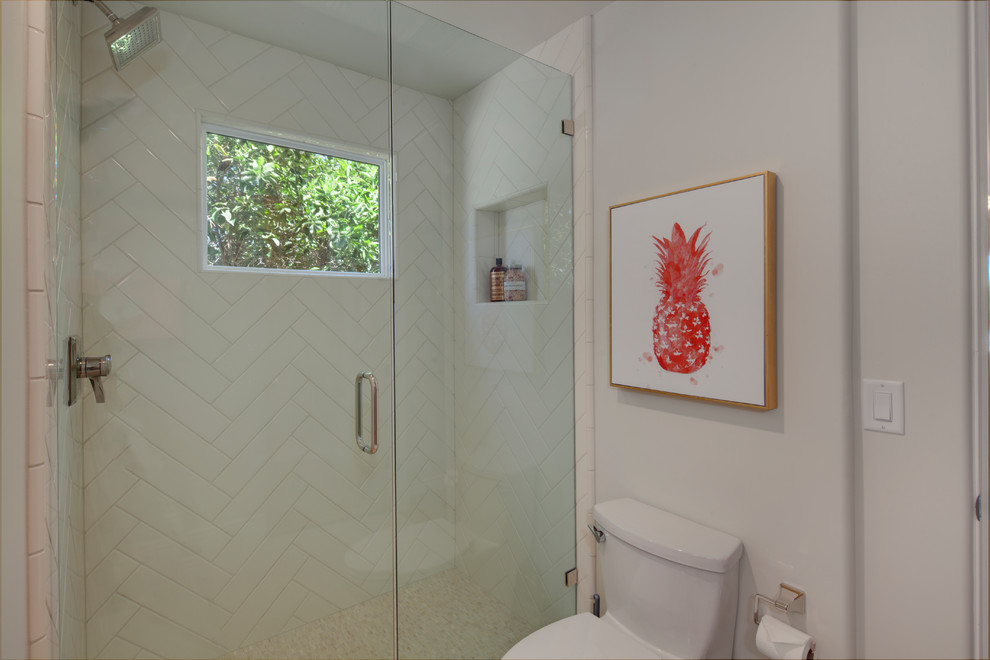 Example of a small beach style 3/4 marble floor and white floor alcove shower design in Phoenix with distressed cabinets, white walls, a vessel sink, wood countertops and a hinged shower door