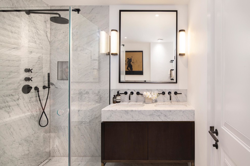 Inspiration for a contemporary 3/4 corner shower remodel in Gloucestershire with flat-panel cabinets, dark wood cabinets, white walls, an undermount sink, a hinged shower door and gray countertops