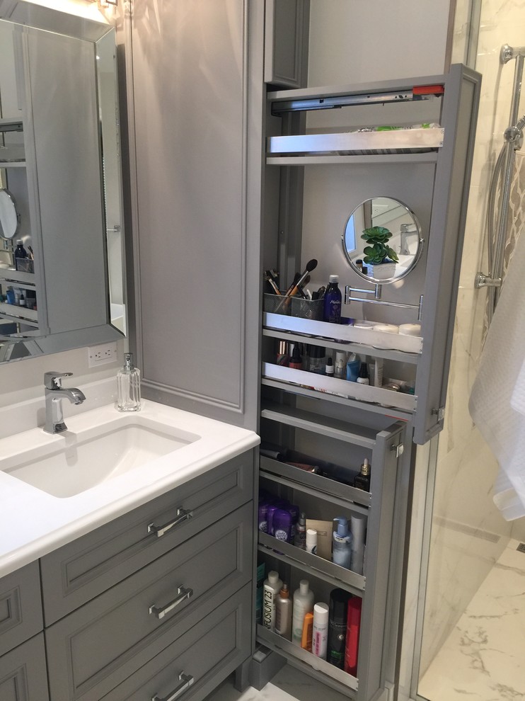 Large transitional master white tile and porcelain tile porcelain tile bathroom photo in Montreal with gray cabinets, a one-piece toilet, gray walls, an undermount sink, quartz countertops and recessed-panel cabinets