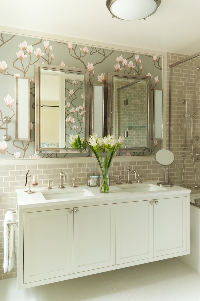 Inspiration for a mid-sized transitional master gray tile and ceramic tile tub/shower combo remodel in New York with an undermount sink, recessed-panel cabinets, white cabinets, quartz countertops, an undermount tub and a one-piece toilet