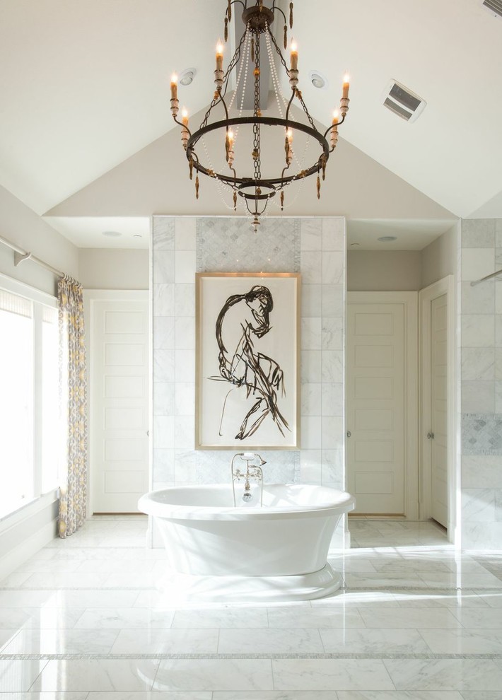 Traditional bathroom in Dallas with a freestanding bath, white tiles and grey walls.