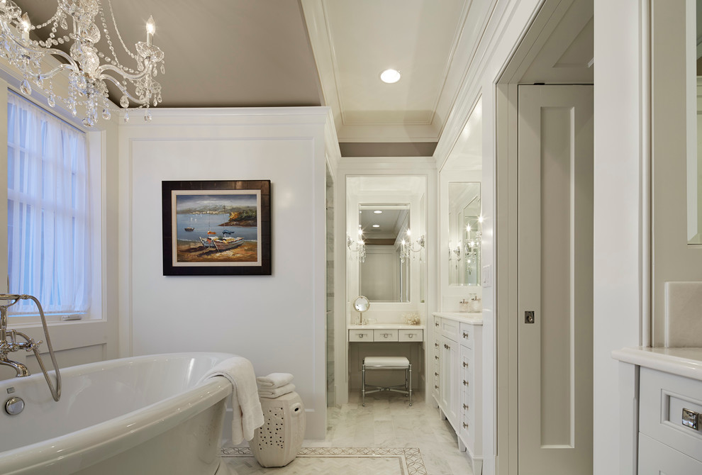 Inspiration for a large timeless master white tile and stone tile marble floor bathroom remodel in Chicago with an undermount sink, recessed-panel cabinets, white cabinets, marble countertops, a two-piece toilet and white walls