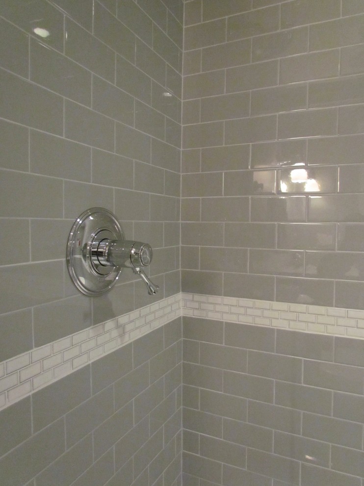 Mid-sized elegant gray tile and ceramic tile ceramic tile alcove shower photo in Chicago with an undermount sink, furniture-like cabinets, distressed cabinets, marble countertops and gray walls