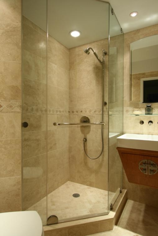 Design ideas for a small classic bathroom in New York with a corner shower, a one-piece toilet, beige tiles and stone tiles.