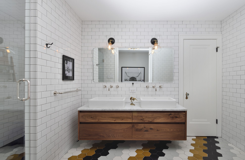 Inspiration for a contemporary ensuite bathroom in Chicago with a vessel sink, flat-panel cabinets, medium wood cabinets, marble worktops, white tiles, metro tiles, white walls and mosaic tile flooring.