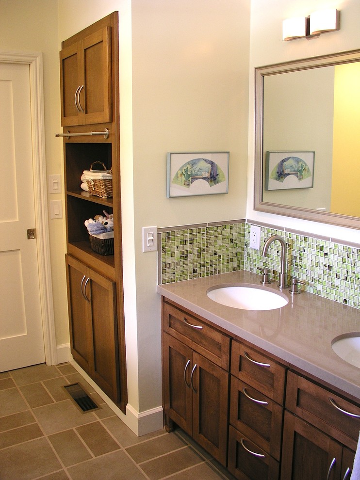 Transitional green tile tub/shower combo photo in Los Angeles with an undermount sink, recessed-panel cabinets, medium tone wood cabinets and quartz countertops