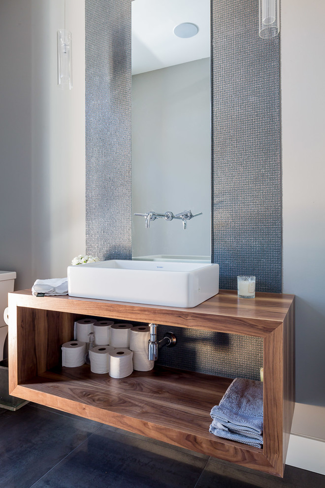 Design ideas for a contemporary bathroom in Toronto with a vessel sink, open cabinets, dark wood cabinets, grey tiles, mosaic tiles and grey walls.