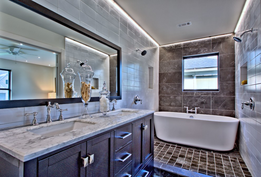 Example of a minimalist master gray tile and porcelain tile slate floor bathroom design in Dallas with an undermount sink, recessed-panel cabinets, dark wood cabinets, marble countertops and gray walls