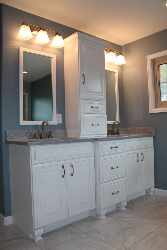 Example of a large classic master gray tile and porcelain tile porcelain tile bathroom design in Denver with an undermount sink, recessed-panel cabinets, white cabinets, granite countertops, a two-piece toilet and gray walls