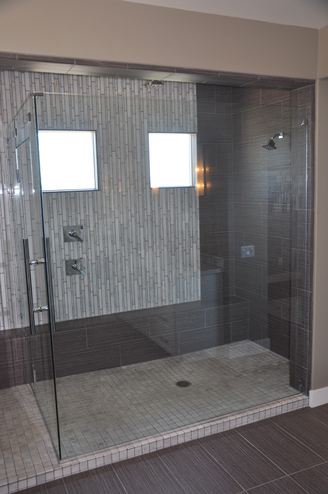 Inspiration for a large modern master white tile and ceramic tile vinyl floor alcove shower remodel in Los Angeles with shaker cabinets, white cabinets, a two-piece toilet, gray walls, a vessel sink and marble countertops