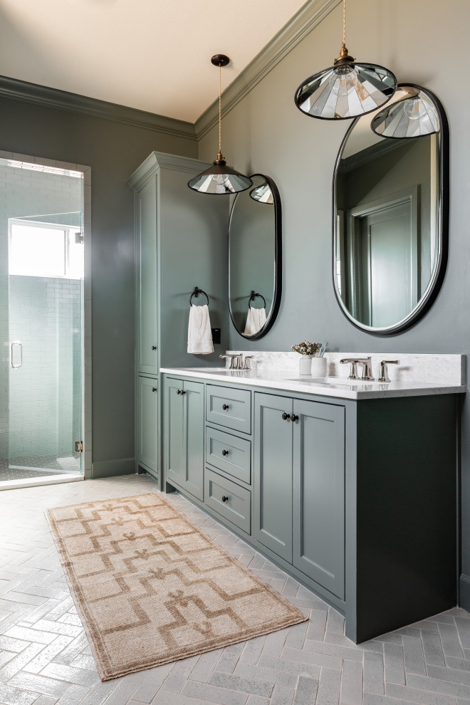 Photo of a large traditional ensuite bathroom in Dallas with grey cabinets, grey tiles, ceramic tiles, grey walls, brick flooring, a hinged door, white worktops, double sinks, recessed-panel cabinets, a submerged sink, grey floors and a built in vanity unit.